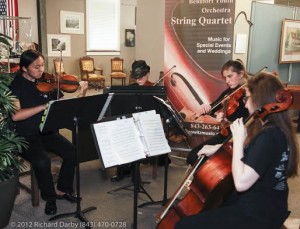 The Beaufort Youth Orchestra String Quartet performed at the Beaufort History Museum art exhibit.                      Pictured (L-R) are Olivia Ward, Aiden Knoles, Elinor Schutte and Hope Chutjian.