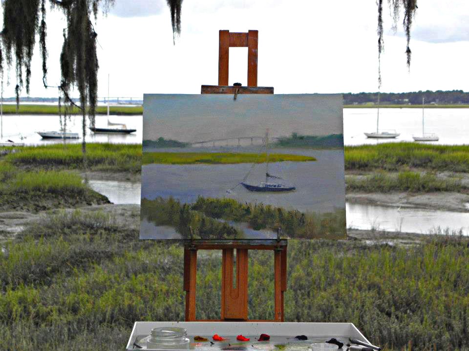 Easel set up along the bluff on Bay Street overlooking the waterfront marshes. 