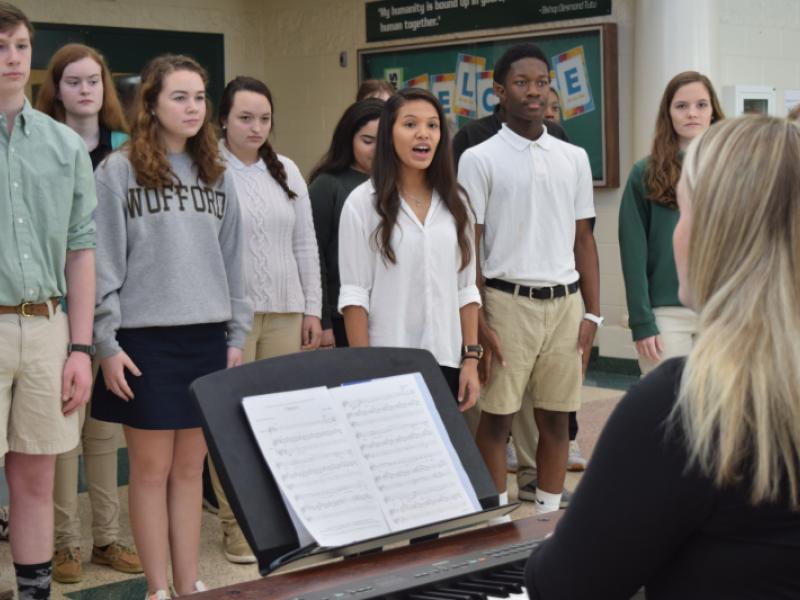 Beaufort High School Voices, a choir group, performed at the entrance of the school Wednesday, practicing their songs to be performed at the Presidential Inaugural Heritage Festival on Saturday. Photo Jessicah Lawrence/Beaufort Today