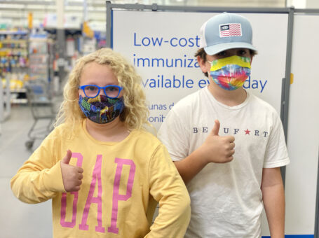 Hogan and Ceci Wareham, Ages 8 and 11 , give a thumbs up after getting their first Covid-19 shots at Walmart on Lady's Island
